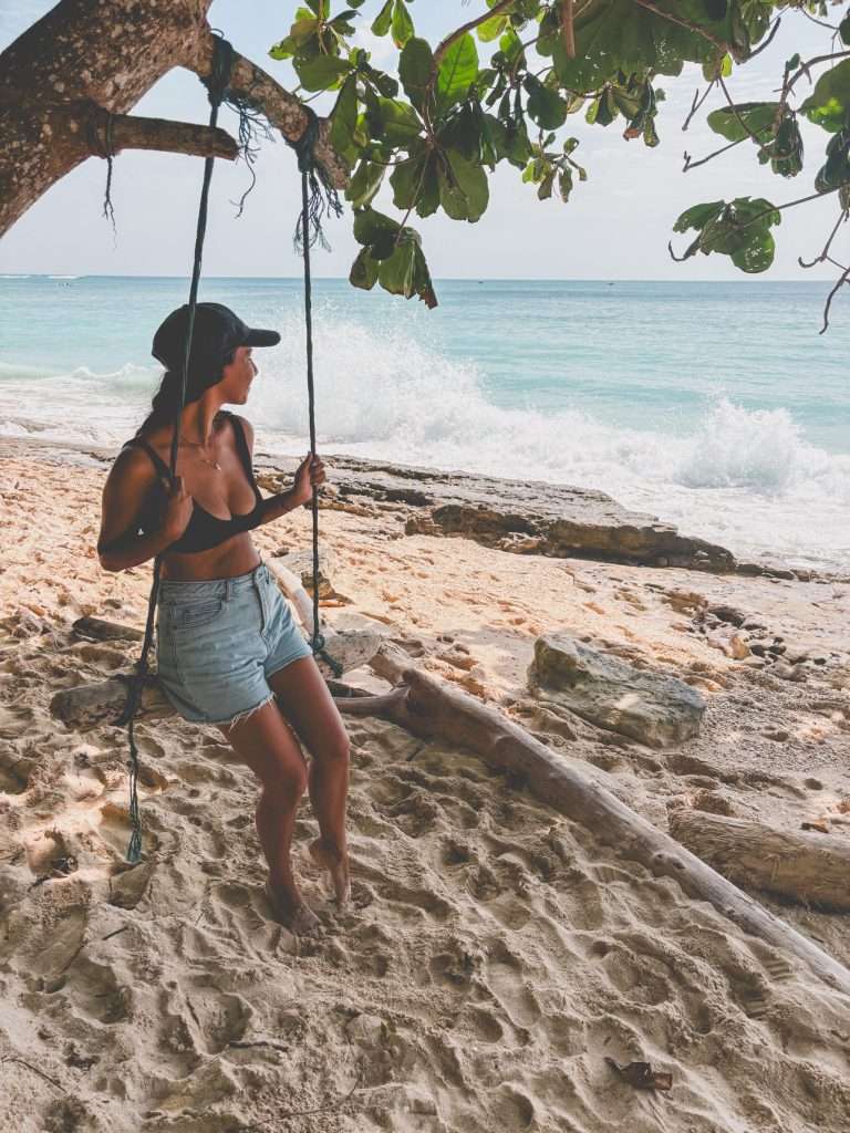 Thomas Beach Girl on swing best Beaches in Uluwatu