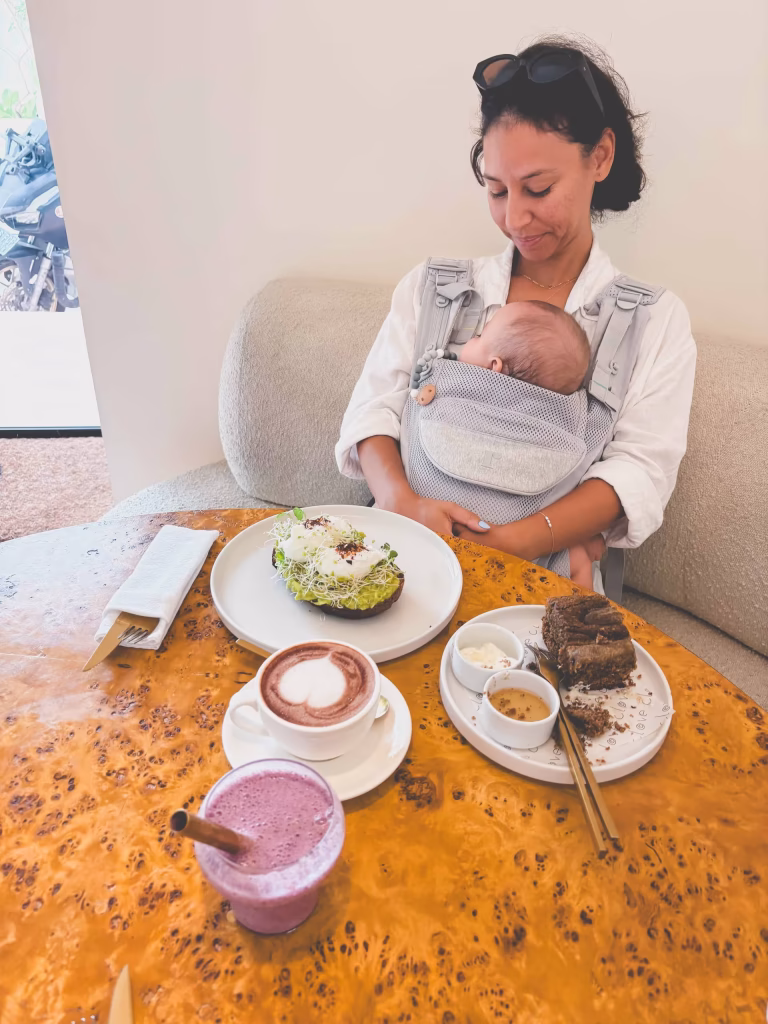 A woman holding a baby.